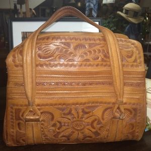 Vintage tooled leather bag. By Flores Bags